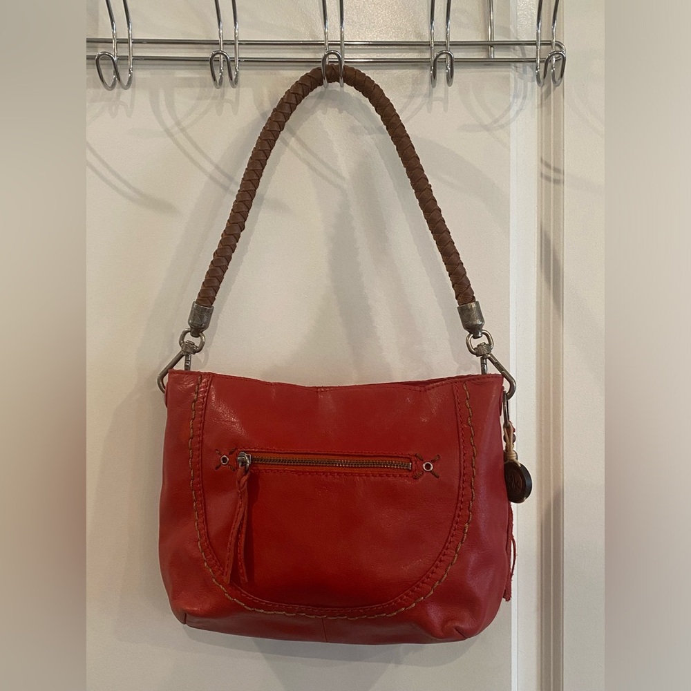 The Sak red leather shoulder bag with braided handle and bead detail
